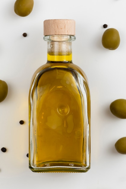 Free photo close-up bottle with fresh olive oil