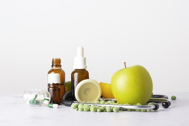 Close-up bottles with oil and pills on the table