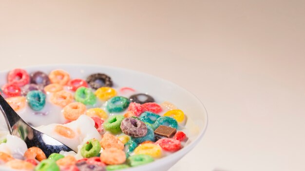 Close-up bowl on table with cereals and milk