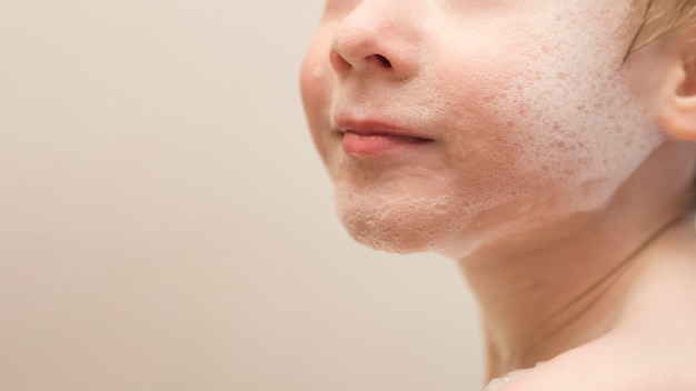 Close-up boy face with foam