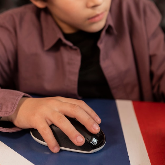 Close up boy with mouse