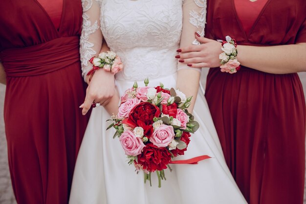 Close-up of bride holding her pretty bouquet