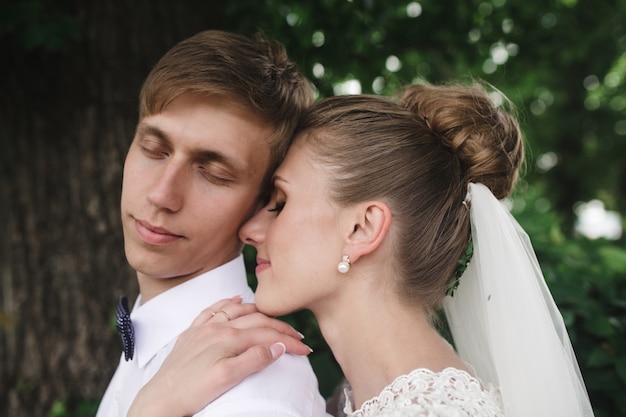 Free Photo close-up of bride hugging her husband