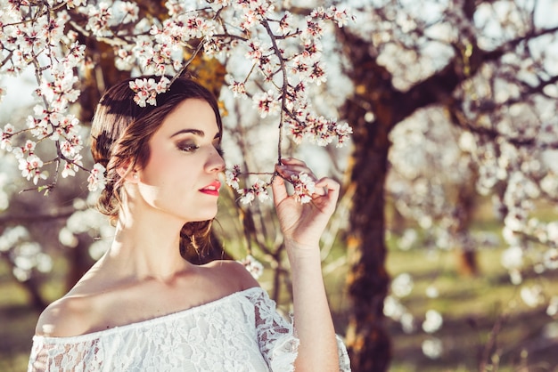 Close-up of bride smelling a flower