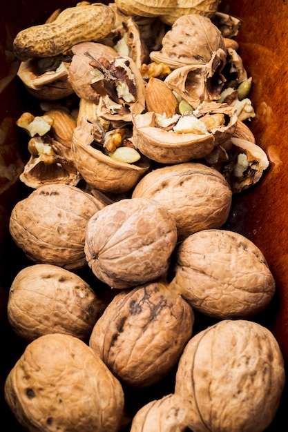 Close-up of broken and whole walnuts