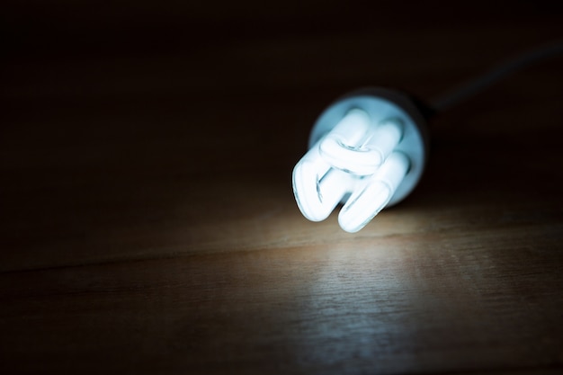 Free photo close-up of bulb glowing on a table