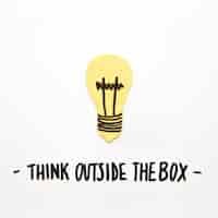 Free photo close-up of bulb with think outside the box text on white background