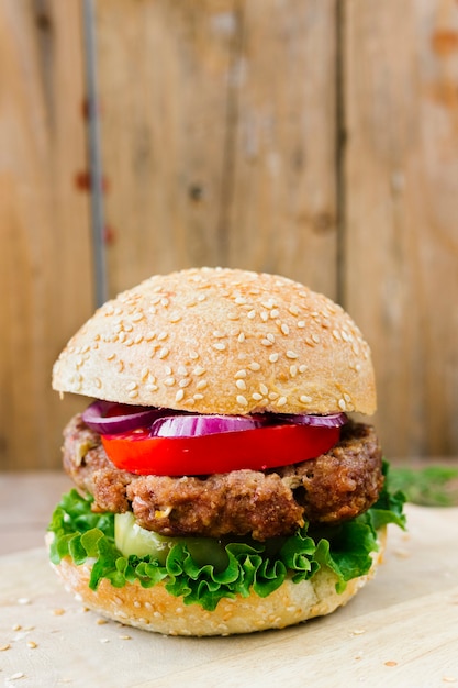 Close-up burger with fries on plate