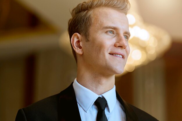 Close up business caucasian man in black suit office background