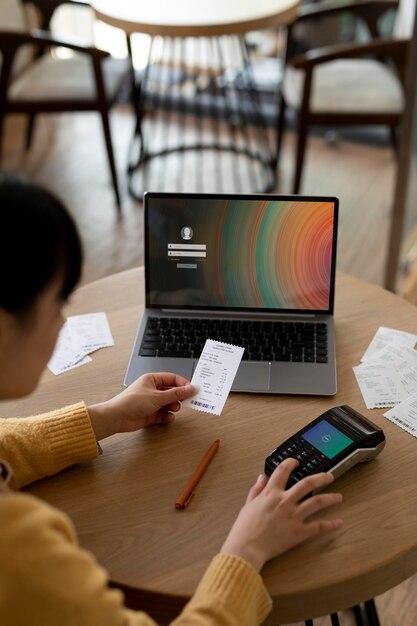 Close up business owner holding receipt