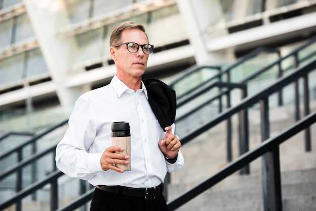 Close-up businessman holding coffee