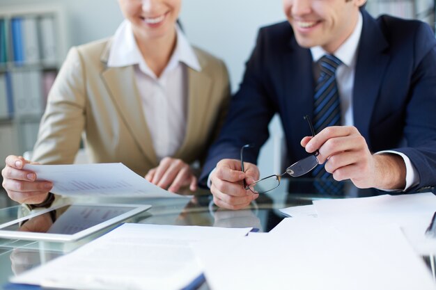 Close-up of businessman holding his glasses