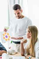 Free photo close-up of a businessman showing graph to his partner in office