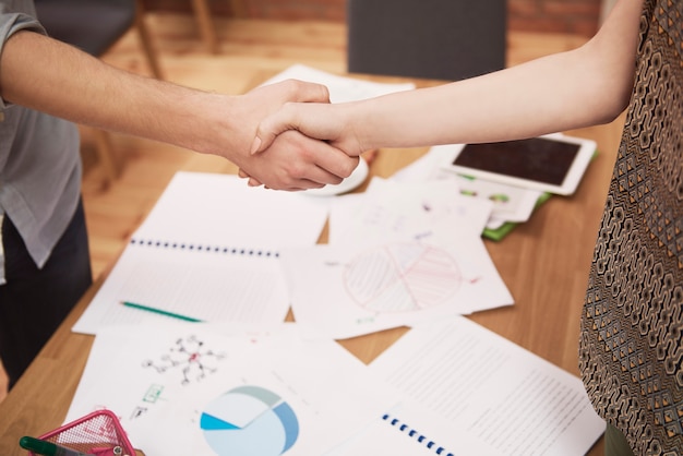 Free Photo close up of businessmen handshake in the office