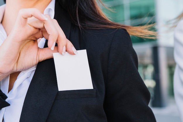 Close up of businesswoman holding card