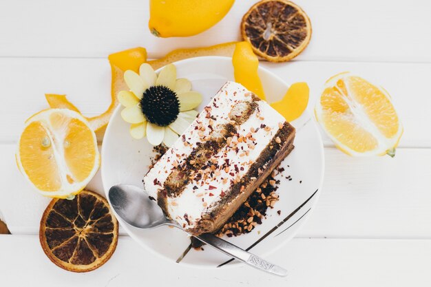 Close-up cake amidst citruses