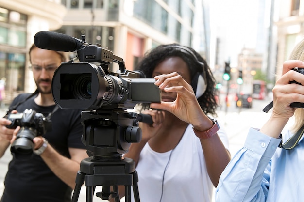 Close up on camera crew filming an interview