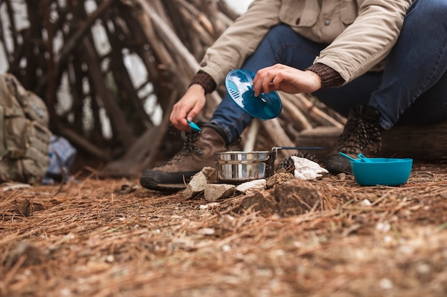 Free Photo close-up camper cooking outdoors