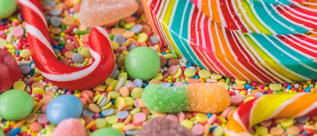 Free photo close up of candy cane and lollipop