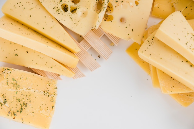 Close-up of cheese wedges on white background