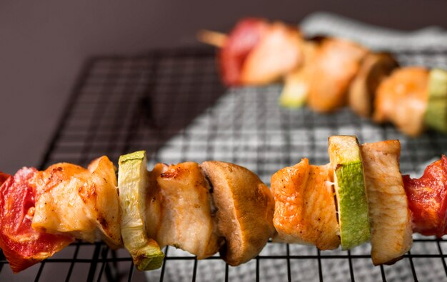 Close-up chicken skewers on tray