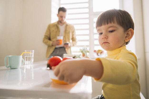 Close-up child and blurred father