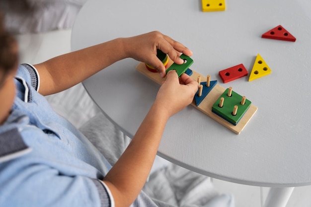 Close up on child enjoying didactic game