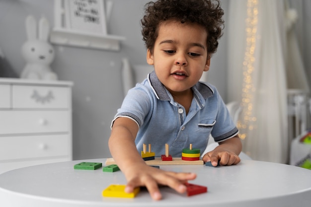 Close up on child enjoying didactic game