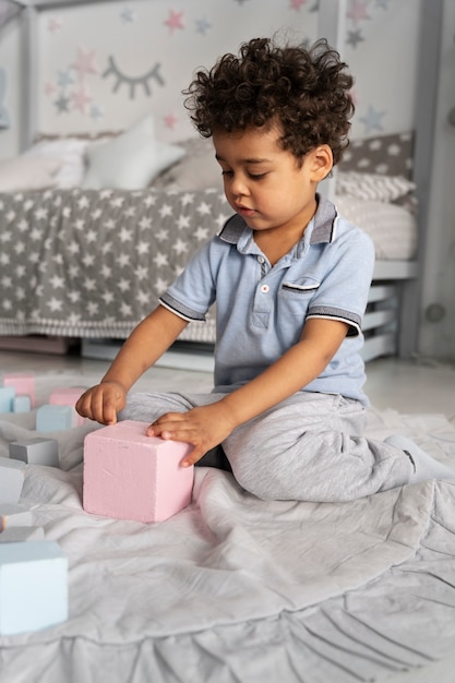 Close up on child enjoying didactic game