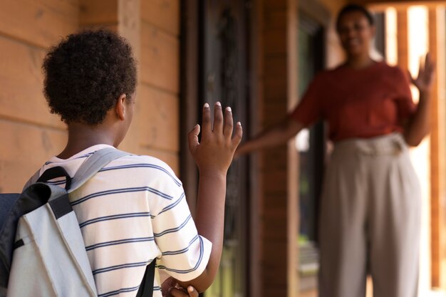 Close up on child leaving for school