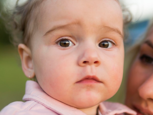 Close-up child in pink clothes