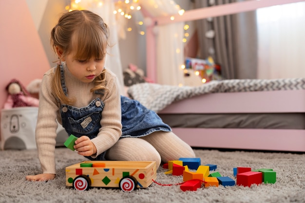 Close up on child playing in her room