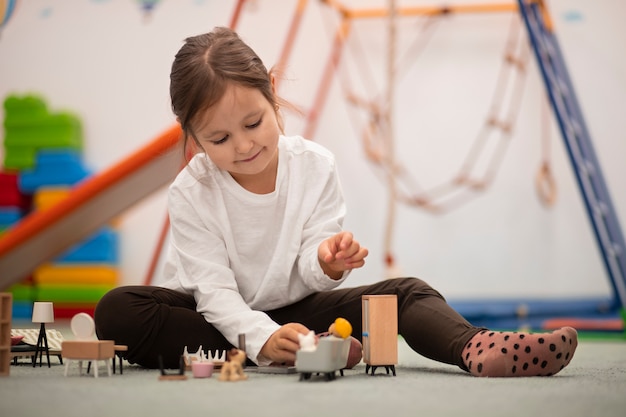 Free photo close up on child playing in her room