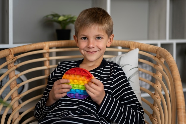 Close up on child playing with pop it toy