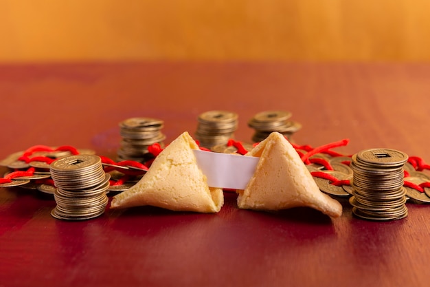 Free Photo close-up of chinese new year fortune cookie with coins