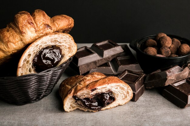 Close-up chocolate bar and croissants