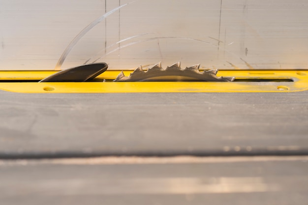 Free Photo close-up of circular saw in table at carpenter's shop