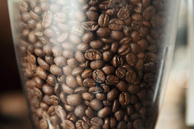 Free photo close up of coffee beans in a grinder