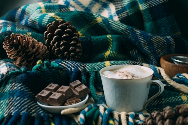 Close-up coffee cup with a blanket