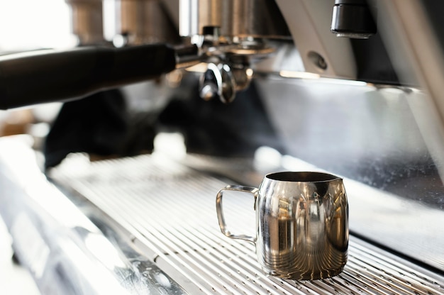 Close up coffee machine and cup