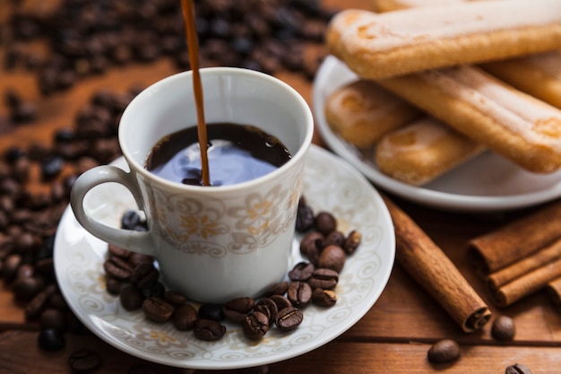 Close-up coffee pouring into cup