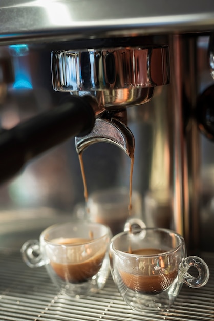 Close-up coffee pouring into cups