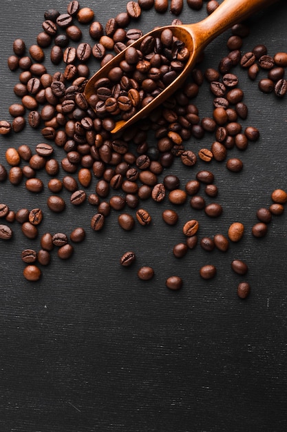 Free Photo close-up coffee scoop with beans