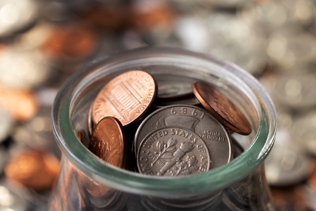 Free photo close up on coins in jar