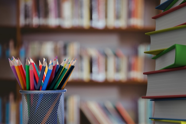 Free photo close-up of colored pencils with books