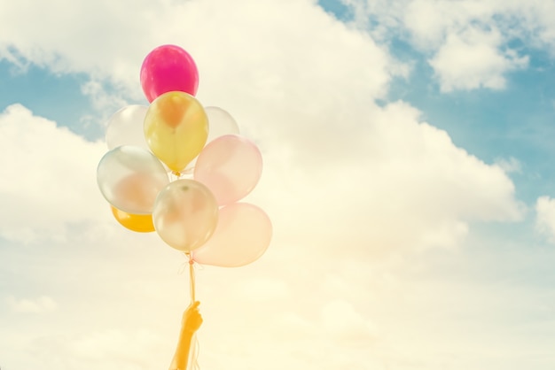 Close-up of colorful balloons with sky background