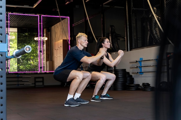 Close up on couple doing crossfit workout