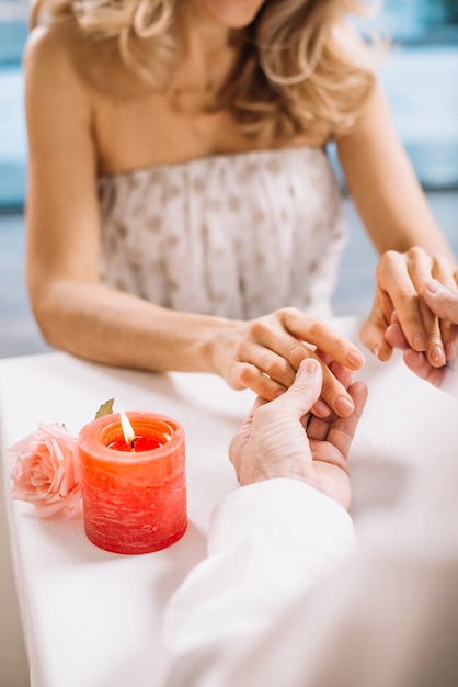 Close-up of couple holding hands