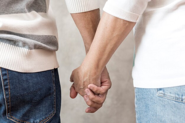 Close-up couple holding hands