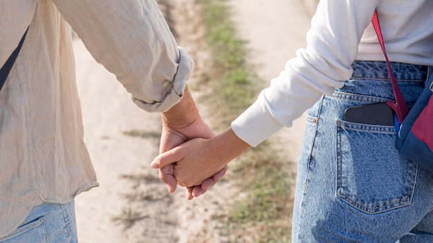 Close-up couple holding hands